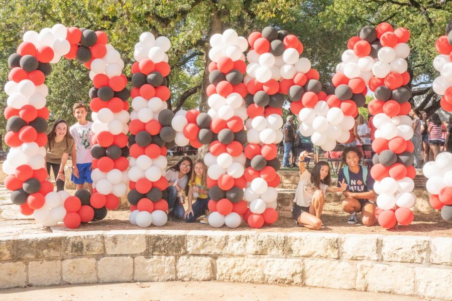 Students pose around the balloon display at the entrance to Round-Up.